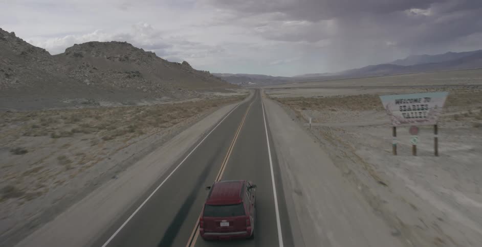 A car drives down the highway