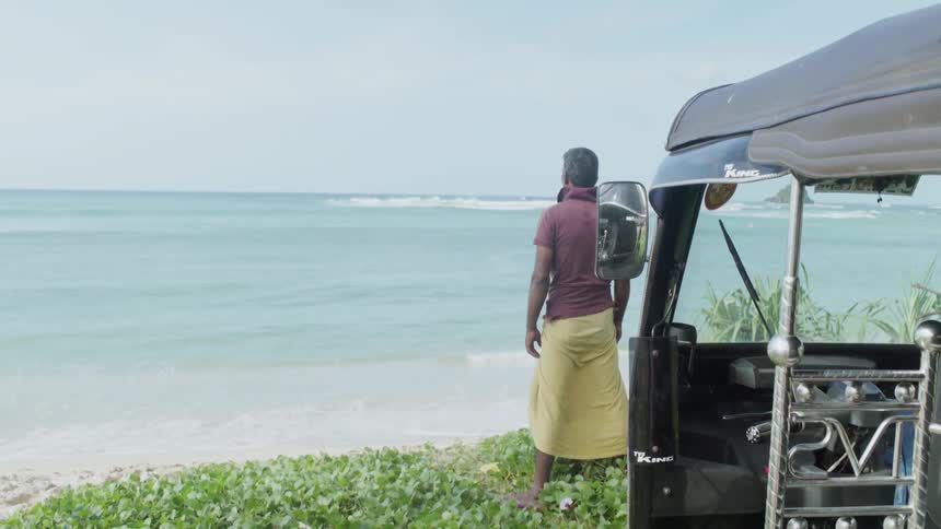 A man stands on a beach