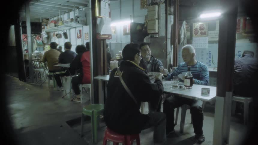 Men play cards in a diner