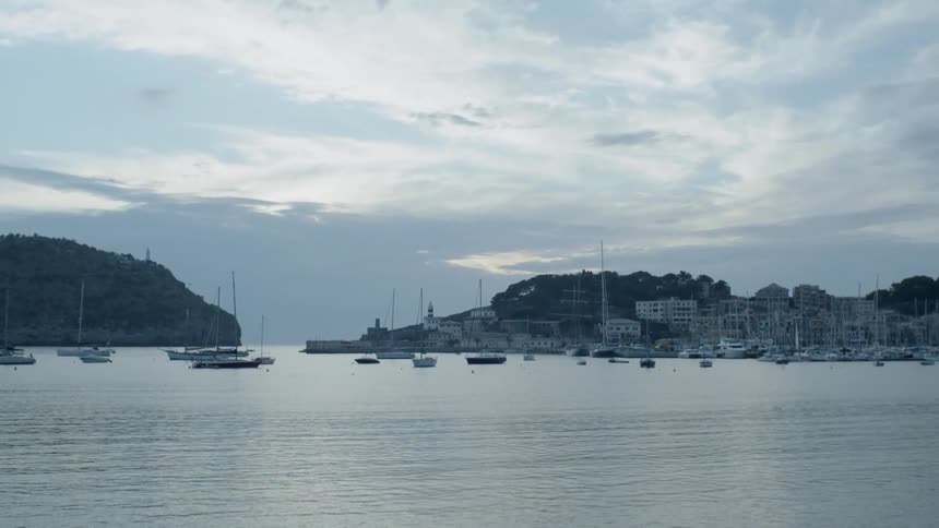 Boats float on the water on a calm day