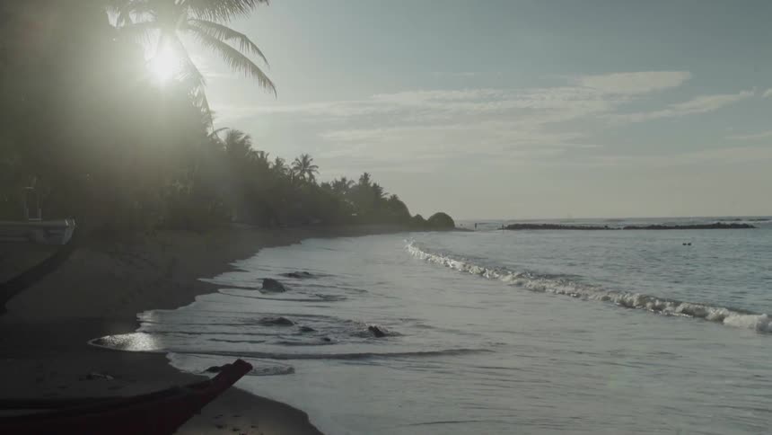 Ocean waves wash ashore a beach