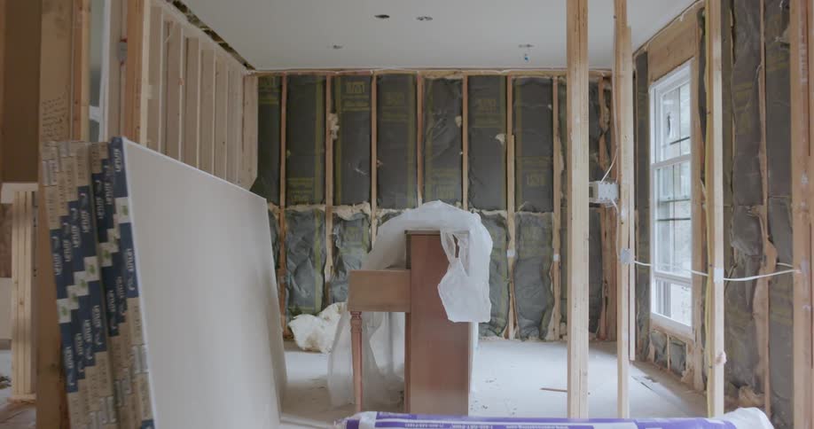 Room with gutted walls being prepared for renovation