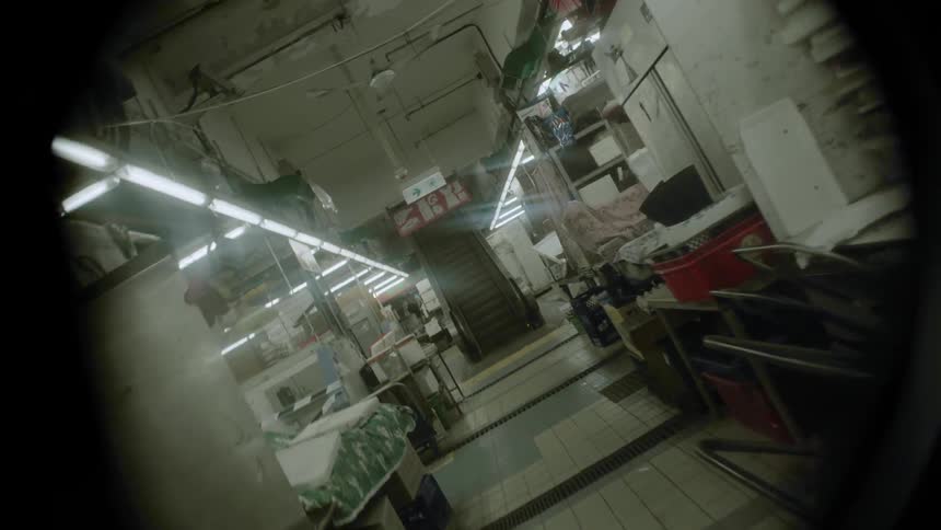 A person walks through a workspace