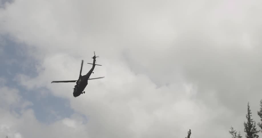 A copter hovers over a field