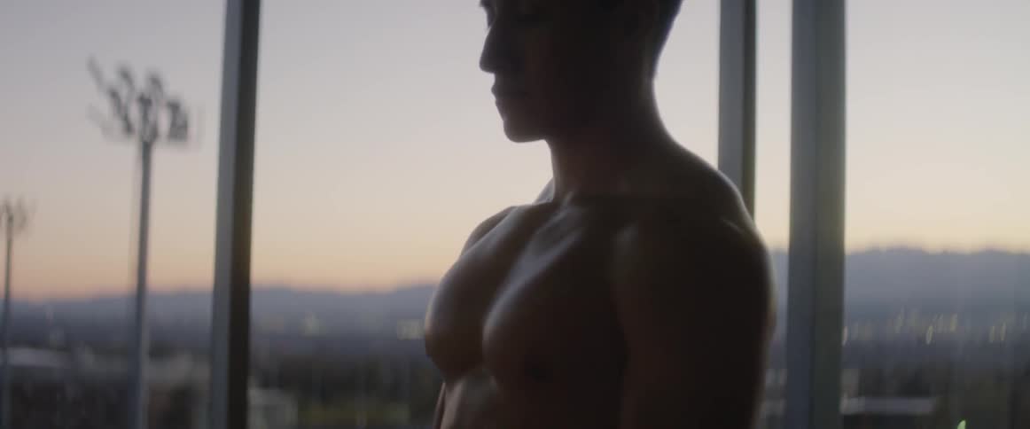 A man is dancing by the window