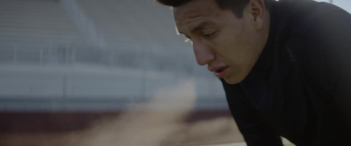 Exercising man stops to catch his breath in the cold