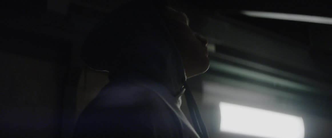 Man stretches in a cold basement