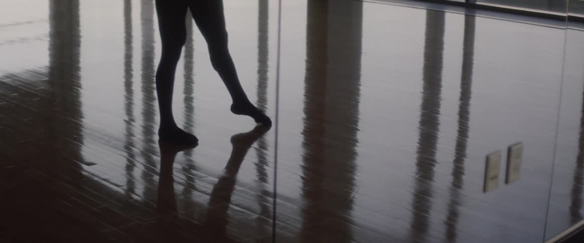 Man does ballet in a dance studio