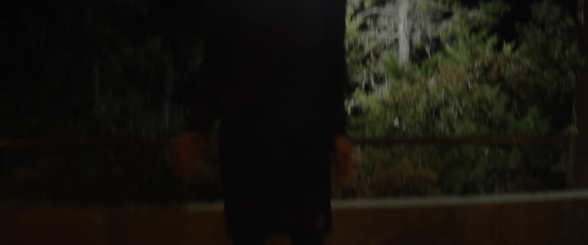 Man outside at night doing jumping jacks