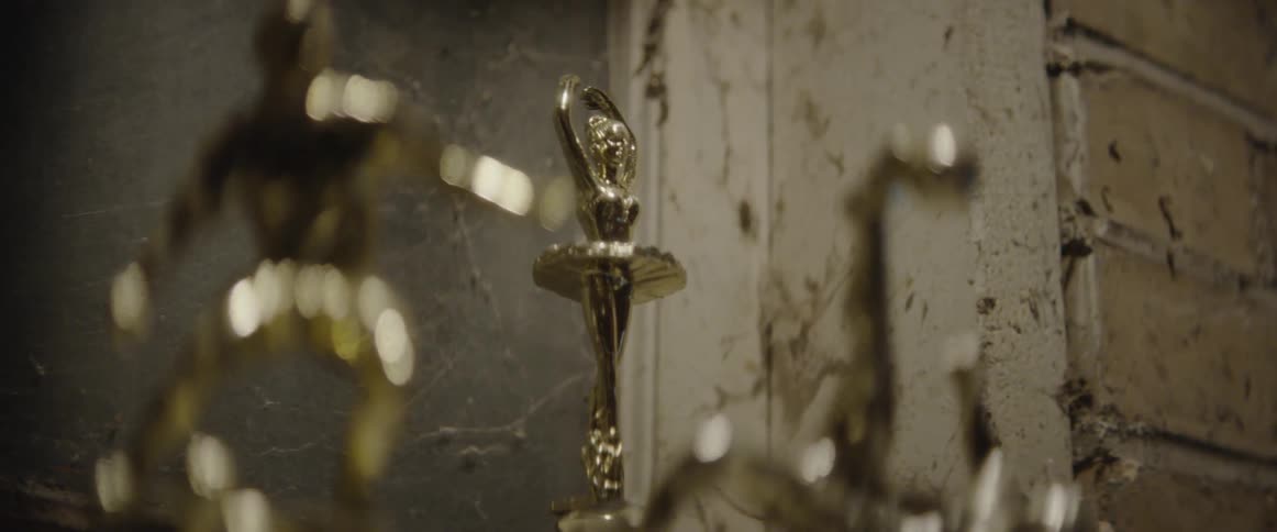 Trophies are displayed in a trophy case