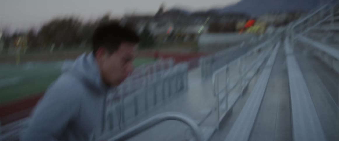 Man sprints up outdoor bleachers