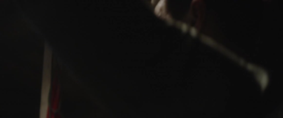 A man is putting his hands behind his head and breathing heavy in a cold environment