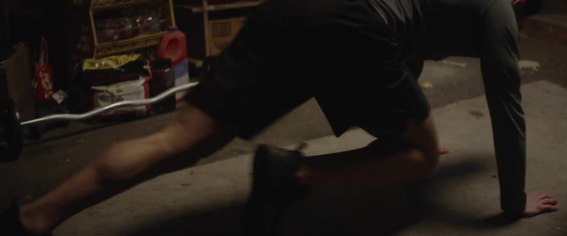 Man exercises in a basement