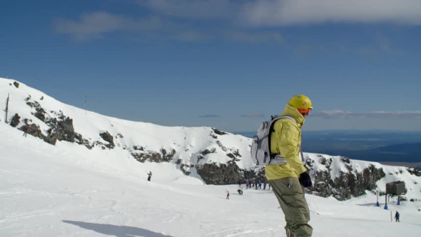 A man is snowboarding