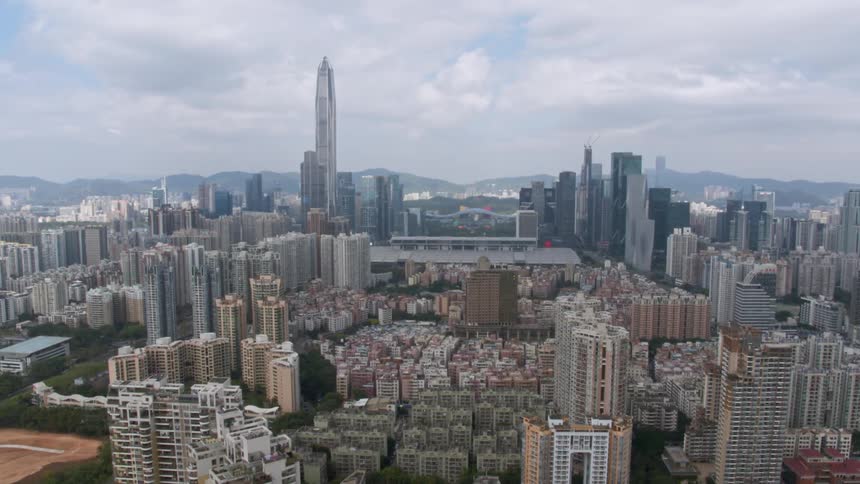 Clouds float above city buildings