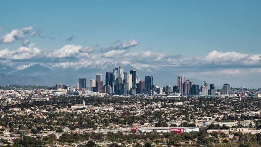 The town leads to the city with tall buildings