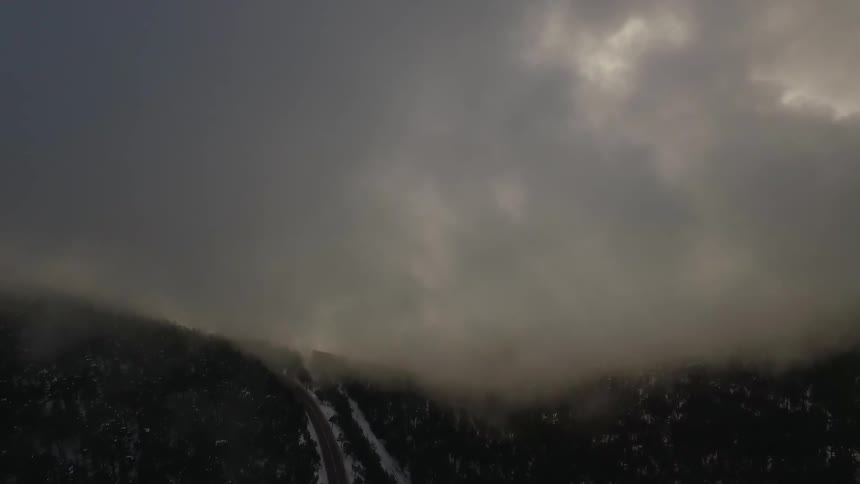 Clouds and fog over a mountain slope