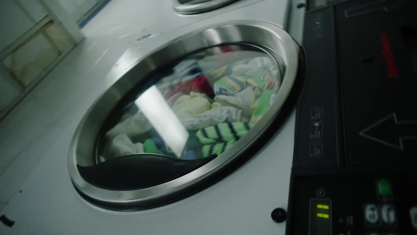 Laundry spins in a laundromat