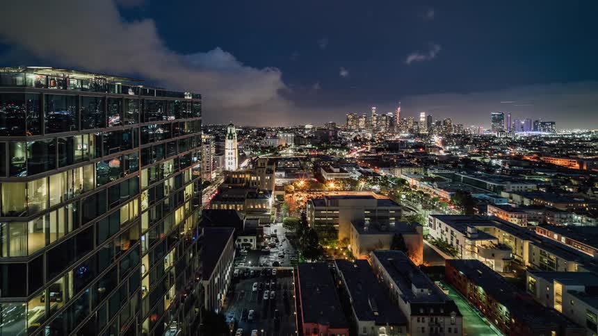 Clouds pass over the city buildings
