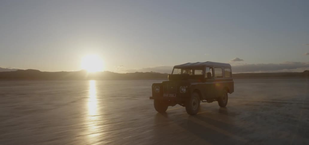 A truck drives down the flats