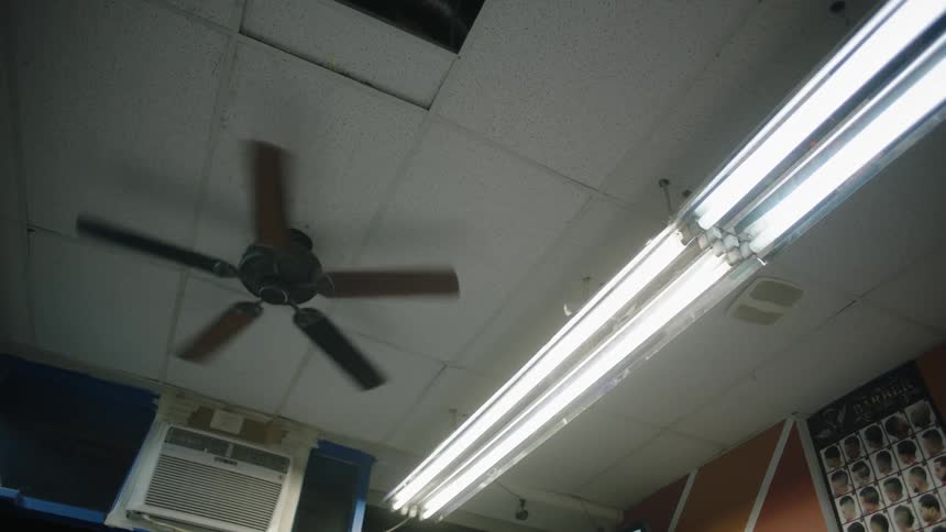 The shop has a fan slowly spinning on the ceiling