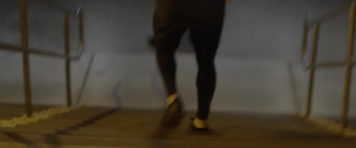 A man is running down the steps