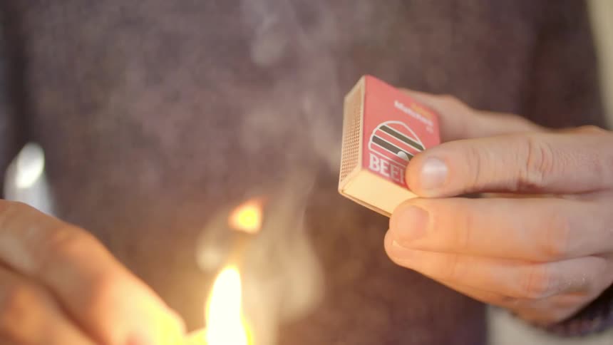 A man strikes a match