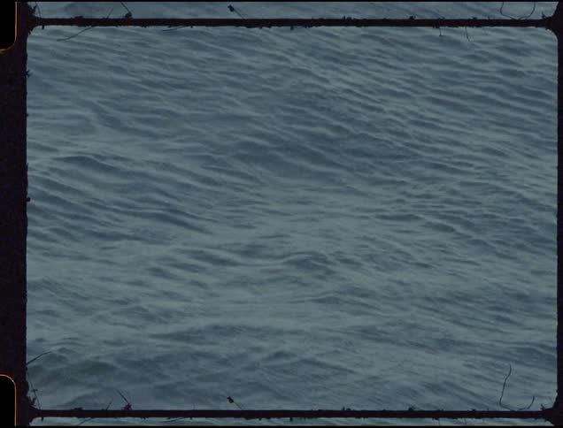 Rain ripples on unsettled water