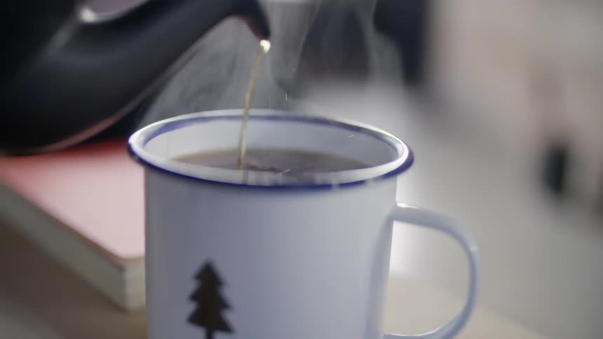 Someone is pouring tea