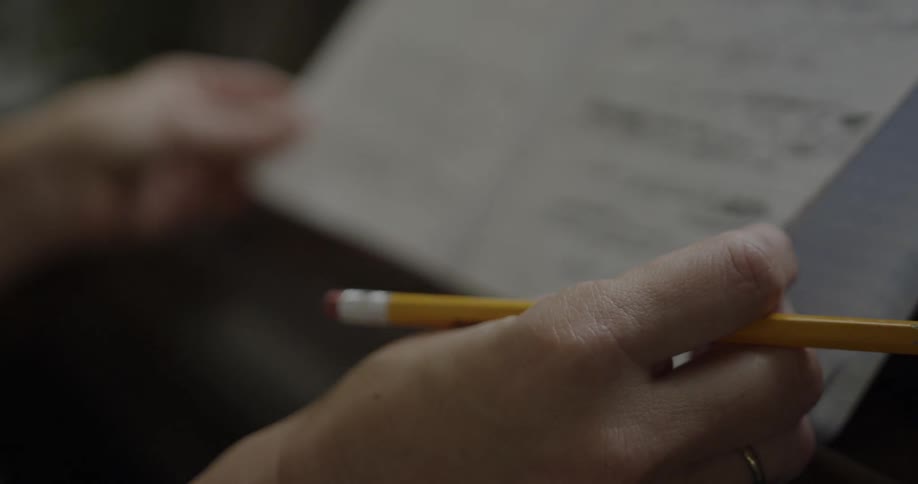 A person is flipping through a notebook