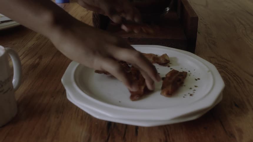 Boys eat breakfast in a dining room