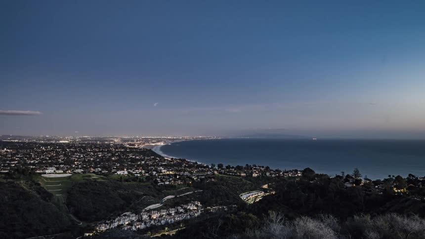 Night falls on a coastal city