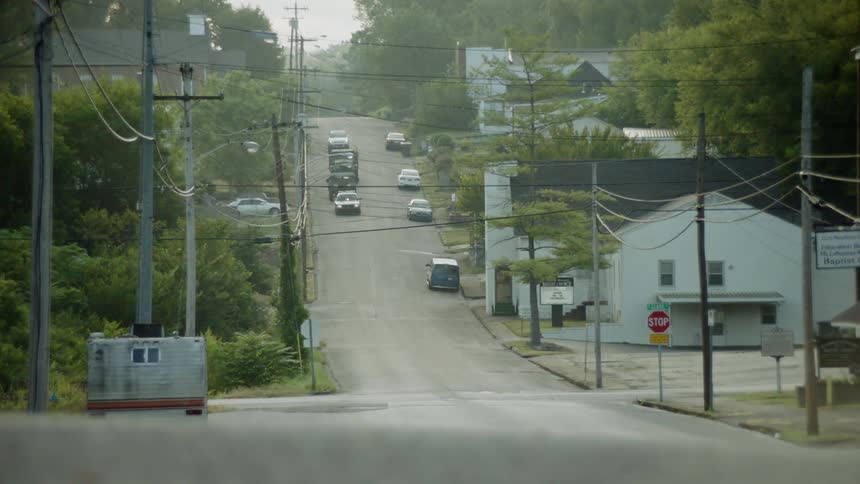 Cars drive on a street