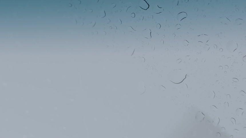 Rains drips down a windshield