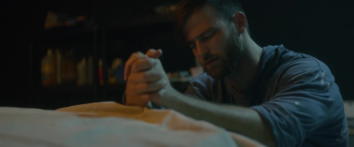 A man is kneeling and praying