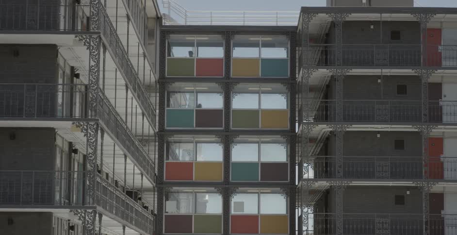 People walking on various floors through a building