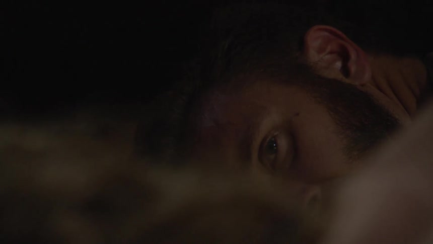A man lies face down on the floor