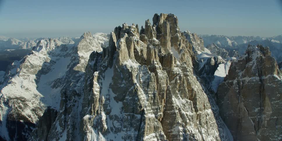 Blue sky over jagged peaks and ridges