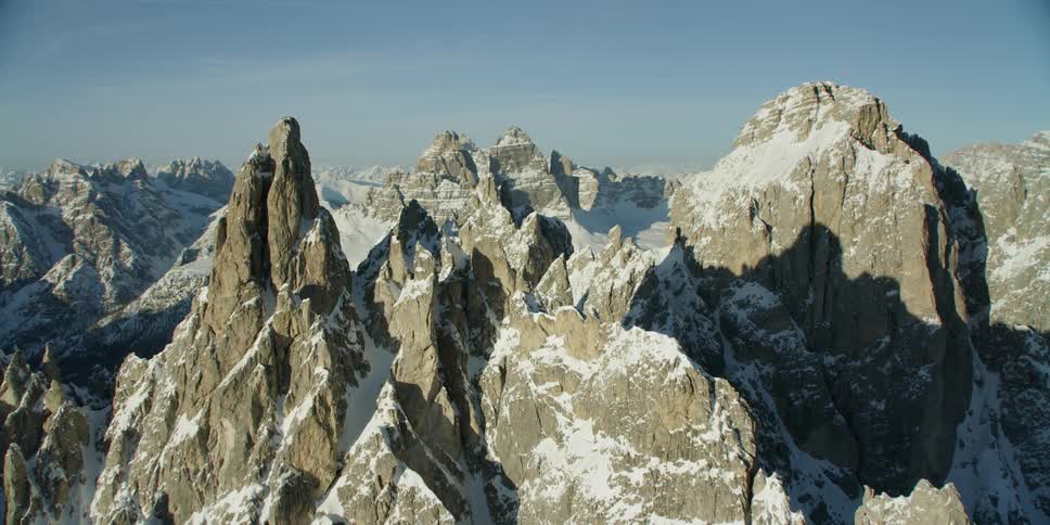 Snow covers rocky mountain peaks