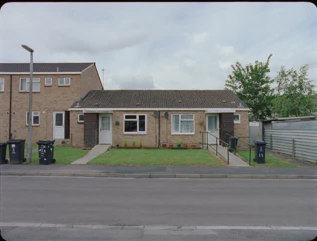 A duplex sits in a neighborhood
