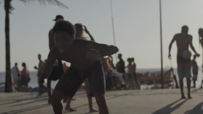 A man dances and does a cartwheel