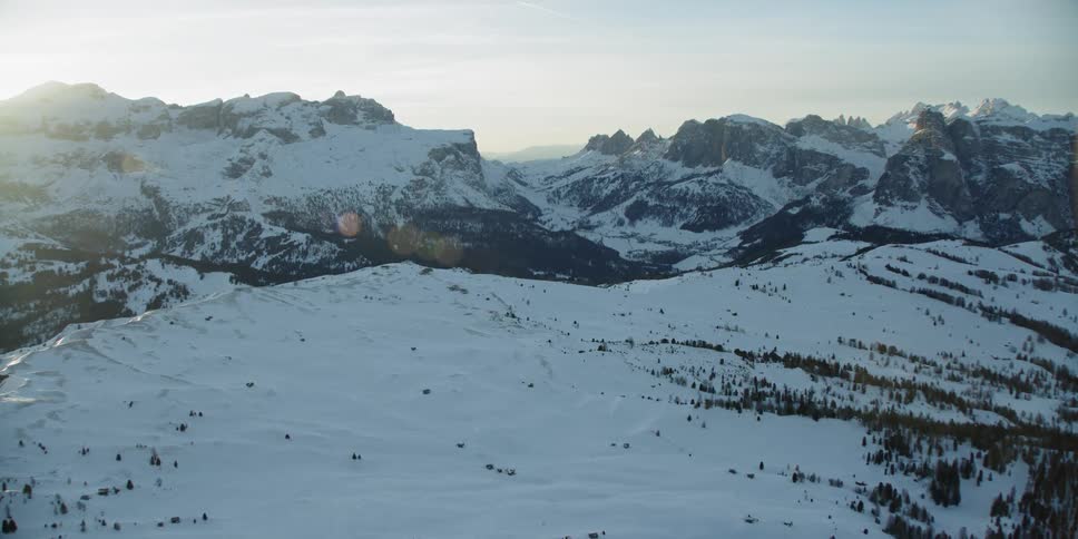 The slope leads up to a large mountain range