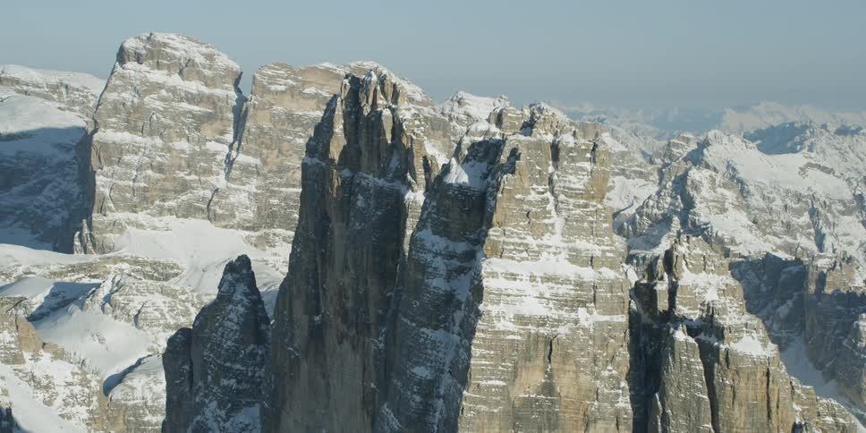 Snow covers rocky mountain peaks