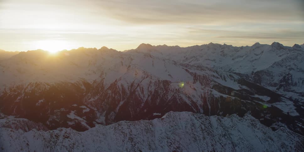 Snow covered mountains at sunset