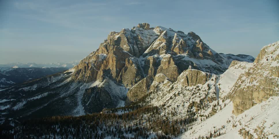 Snow covers rocky mountain peaks