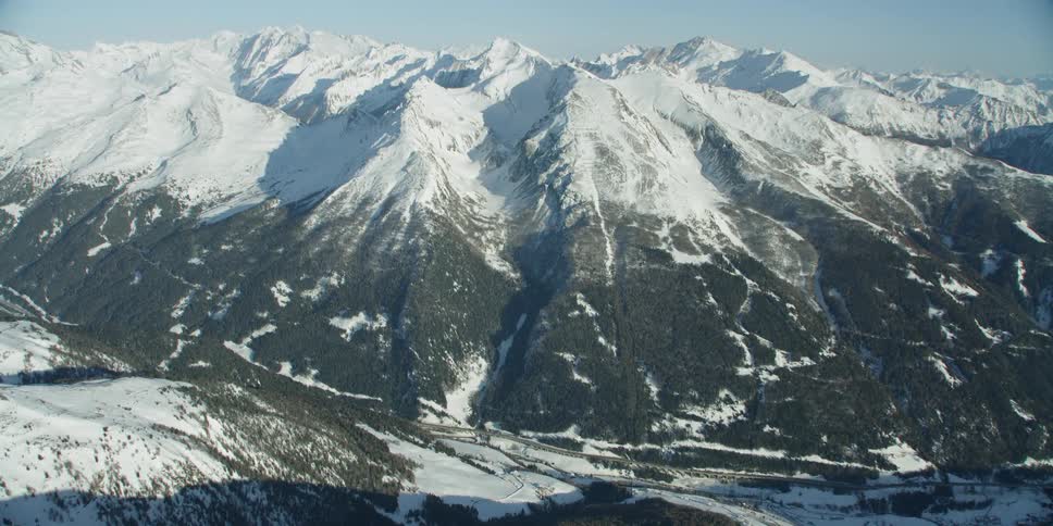 Snow covered mountains under a blue sky