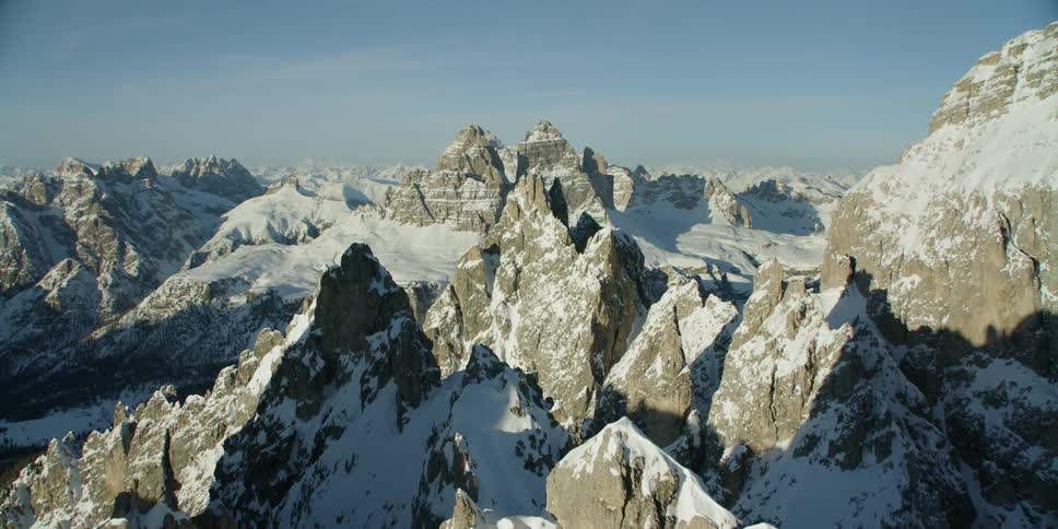 The mountains are pointy and covered with snow