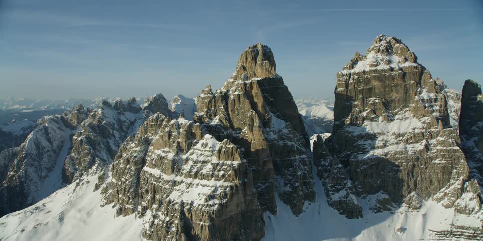 Snow covered mountains under a blue sky