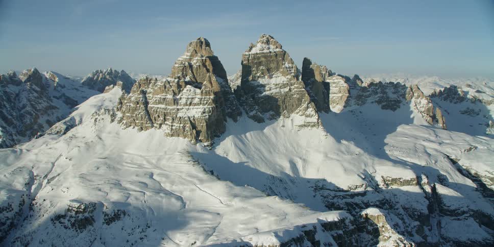 Snow covers rocky mountains