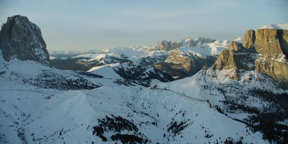 A jagged mountain range and slopes covered in snow